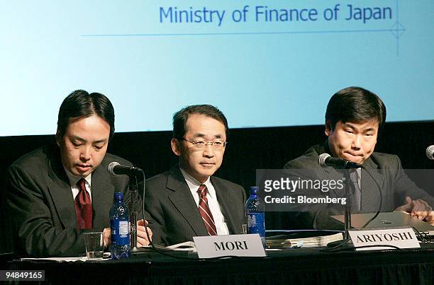 Nobuchika Mori, left, Deputy Consul General of Japan in New York presides over a seminar titled, "The Japanese Economy & Japanese Government Bonds,"...