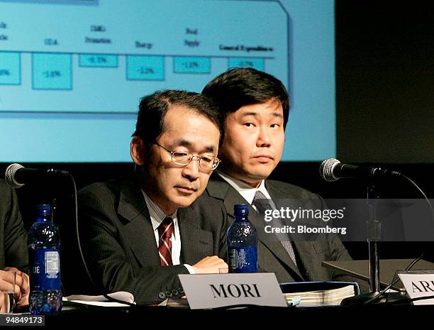 Akira Ariyoshi, left, Councillor, Ministry of Finance and Chikahisa Simi, right, Director Market Finance Division, Ministry of Finance speak at a...