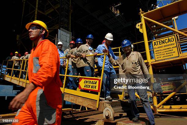 Rig workers take a break on the Petroleo Brasileiro SA P-51 oil platform at the Keppel-Fels Shipyard in Angra dos Reis, Rio de Janeiro, Brazil, on...