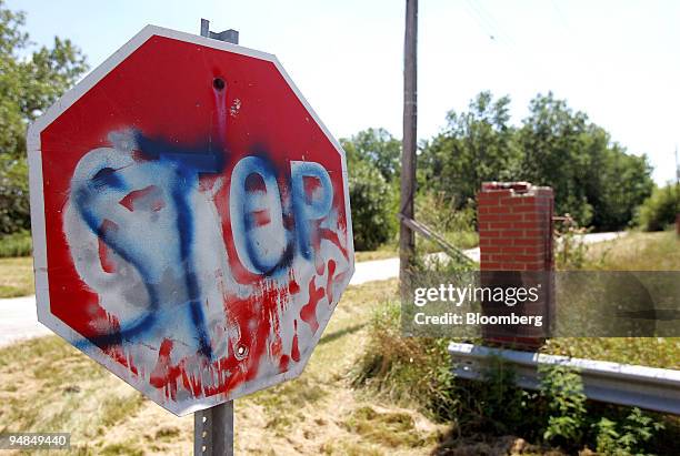 Dilapidated stop sign stands near a vacant field in an area that Ford Heights Ethanol LLC had applied to build a refinery in Ford Heights, Illinois,...