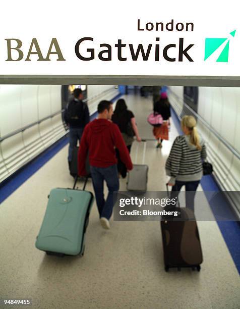 Airline passengers enter the North Terminal at Gatwick airport in Crawley, Sussex, U.K., on Wednesday, Aug. 20, 2008. Global Infrastructure Partners,...