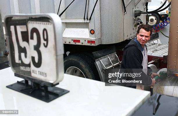 Trucker pumps fuel at the Joyce Kilmore service area off the New Jersey Turnpike in New Jersey, Monday, April 12, 2004. Gasoline futures rose to the...