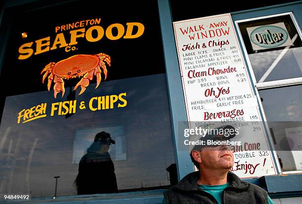 David Friedman, a boat captain, sits outside a Princeton Seafood Co. Stall in Half Moon Bay, California, U.S., on Tuesday, April 22, 2008. Earlier...