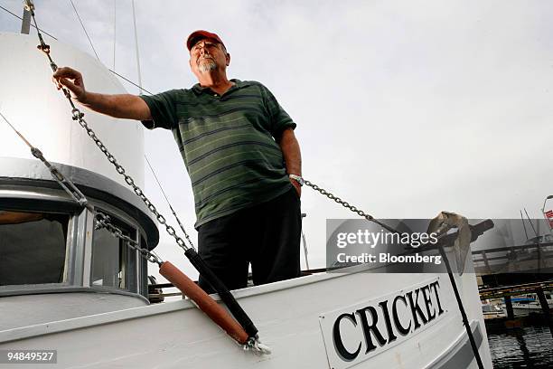 Bill Webb, captain of the commercial fishing boat "Cricket," poses on his boat at Pillar Point Harbor in Half Moon Bay, California, U.S., on Tuesday,...