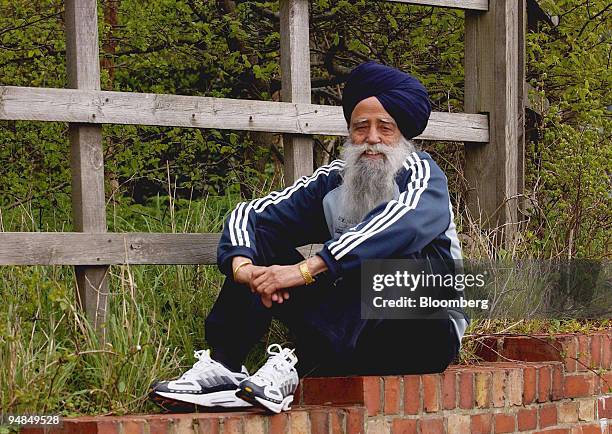 Fauja Singh rests after a run near his home in Ilford, England, Saturday, April 10, 2004. Jeffrey Archer, the novelist and once-jailed Conservative...
