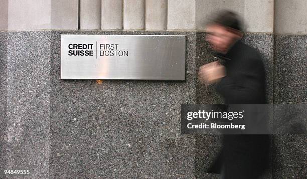 Pedestrian walks past Credit Suisse First Boston offices Tuesday, December 2004, in New York. Credit Suisse Group's decision to fold its Credit...