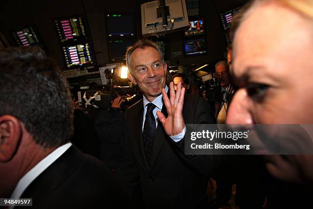 Tony Blair, former prime minister of the United Kingdom, waves as he exits the trading floor at the New York Stock Exchange in New York, U.S., on...