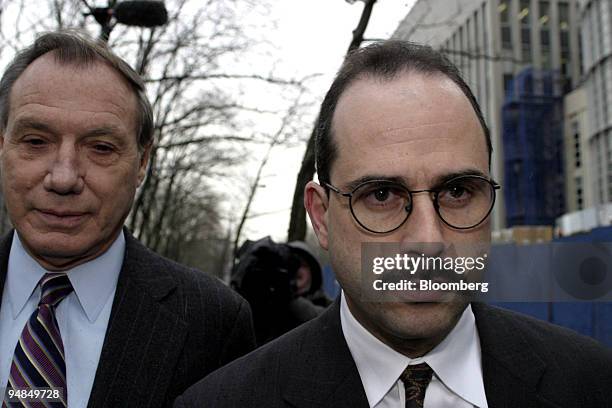 Ira Zar, right, leaves Brooklyn Federal Court after pleading guilty during his arraignment today April 8 in Brooklyn, New York. At left is Andrew...