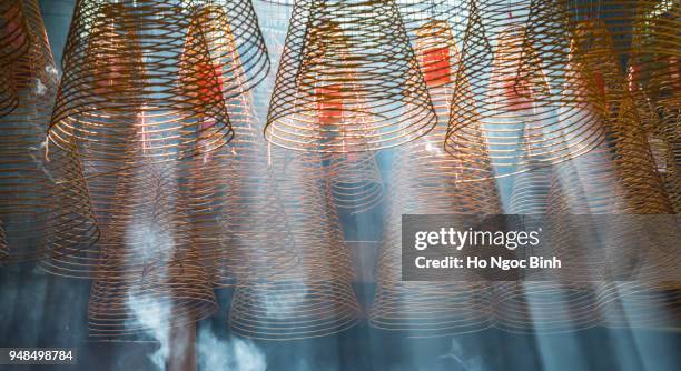 incense coils in historic tin hau temple, yau ma tei, kowloon, hong kong, china - incense coils stock-fotos und bilder