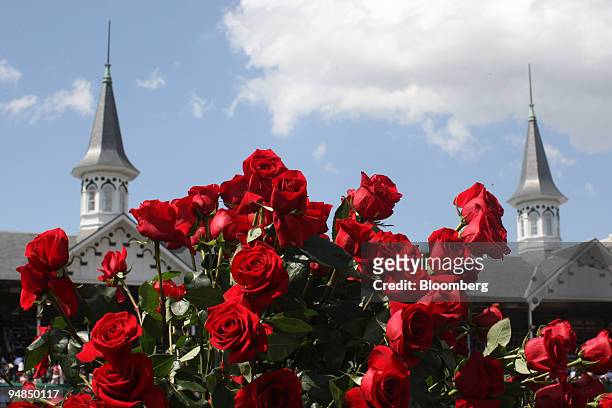The twin spires stand beyond a bouquet of roses at Churchill Downs prior to the Kentucky Derby in Louisville, Kentucky, U.S., on Saturday, May 3,...