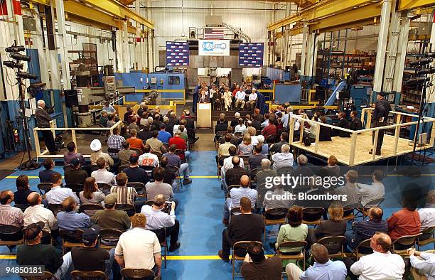 United States Department of Commerce Secretary Donald L. Evans, center at podium, announces to employees of Ariel Corporation the Bush...