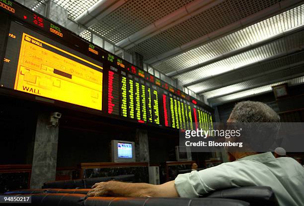 An investor monitors the index at Karachi Stock Exchange in Karachi, Pakistan, on Monday, Sept. 8, 2008. Pakistan's Asif Ali Zardari is set to take...