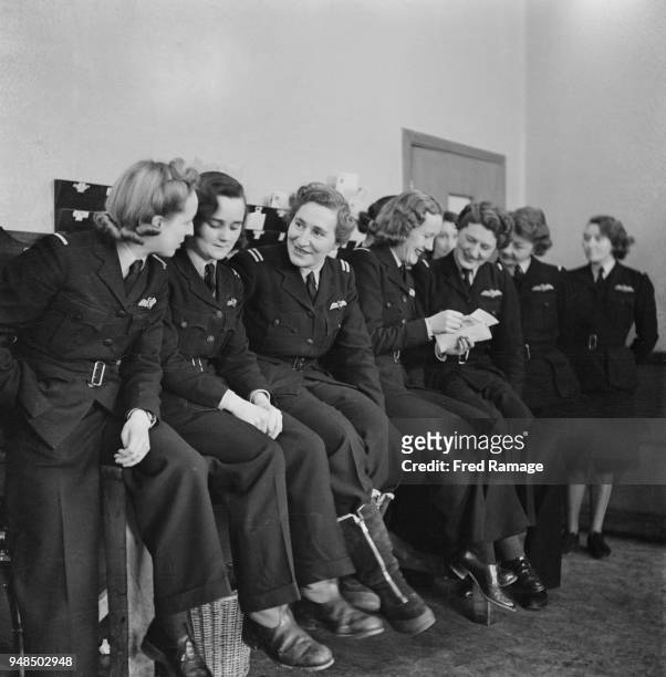 Women Pilots of the Air Transport Auxiliary relaxing and reading their mail at the organization's HQ at White Waltham Airfield in Berkshire, June...