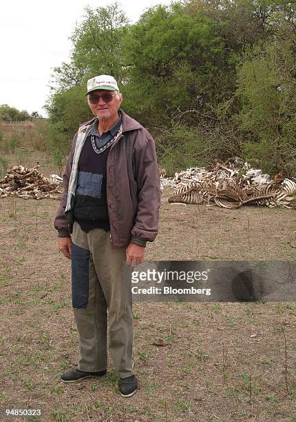 Farmer Johan Rode poses for a portrait with cattle bones on his land in the Chaco province of Argentina, on Sept. 5, 2008. Argentina's worst drought...