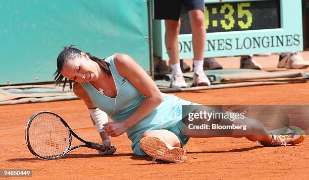 Jelena Jankovic of Serbia picks herself up after a slip during the match against to Agnieszka Radwanska of Poland on the eighth day of the French...