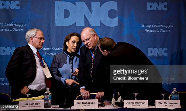 Democratic National Committee Rules and Bylaws Committee Co-Chairs Alexis Herman, left, and Jim Roosevelt, second from right, converse with Joe...