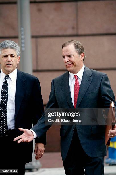 Former Enron ex-Chief Executive Officer Jeff Skilling, right, returns to the Bob Casey Federal Courthouse in Houston, Texas on February 14, 2006 with...