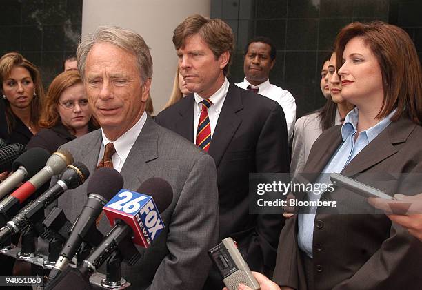Defense attorney Mike DeGeurin, left, answers media question as his client Lea Fastow, former Enron Corp. Assistant treasurer and wife for former CFO...