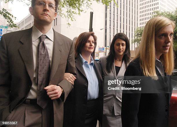 Lea Fastow, second from left, former Enron Corp. Assistant treasurer, arrives at the federal courthouse in Houston, Texas April 7, 2004 with friends...