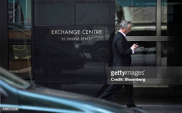 Pedestrian walks past the Australia Securities Exchange building in Sydney, Australia, on Tuesday, Nov. 18, 2008. The S&P/ASX 200 Index dropped 60.10...