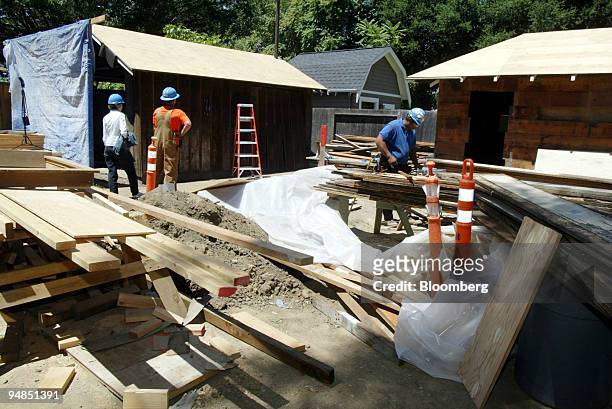 Wood is stacked near the 'HP garage,' building at left, as restoration continues on the grounds of 367 Addison Ave. In Palo Alto, California...
