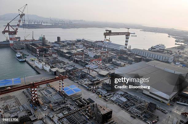 Yantai Raffles Shipyard Ltd. Gantry crane towers above the company's shipyard in Yantai, China, on Friday, April 18, 2008. Yantai Raffles Shipyard...