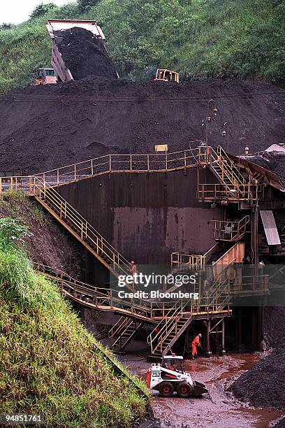 Truck dumps a load of manganese ore into a 10-story high processing plant at Cia. Vale do Rio Doce's processiing plant at Carajas, Brazil, on...