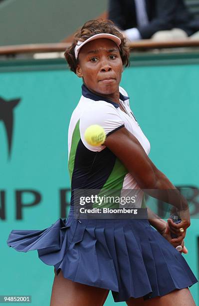Venus Williams of the U.S. Keeps her eye on the ball as she returns it to Selima Sfar of Tunisia during their match on the fifth day of the French...