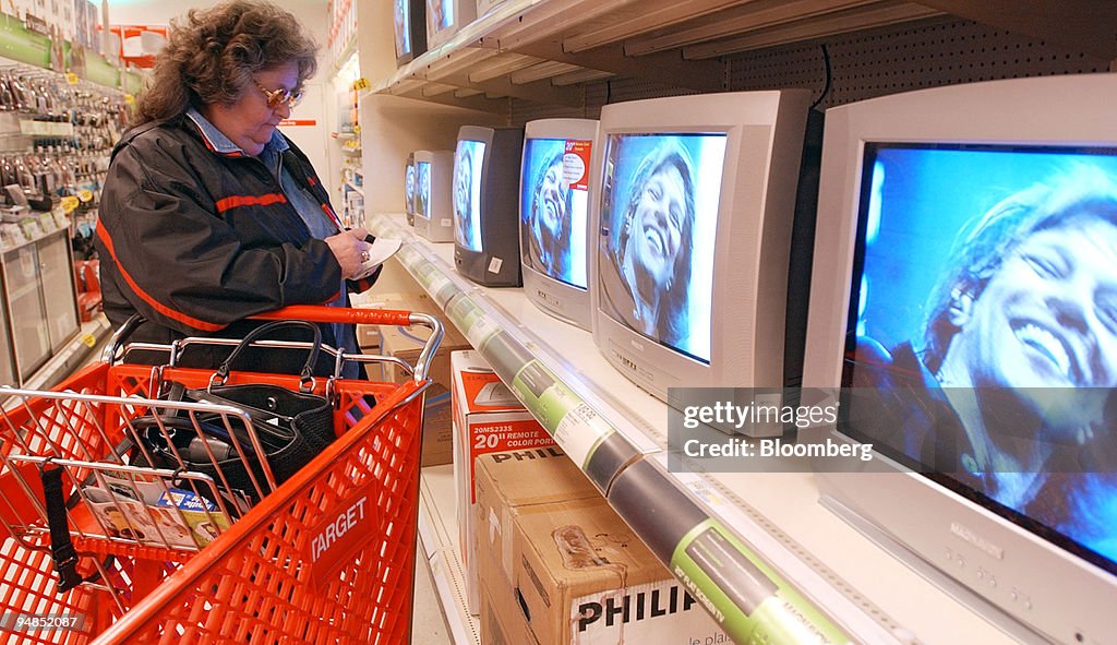 Target Screen Shoping A shoppers looks at televisions for sale at a Target store at the ...