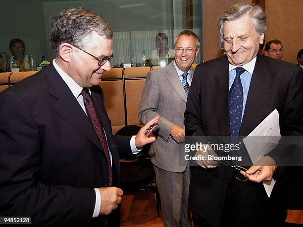 German Finance Minister, Hans Eichel, center, greets European Central Bank Vice-President, Lucas Papademos, left, and President of the European...