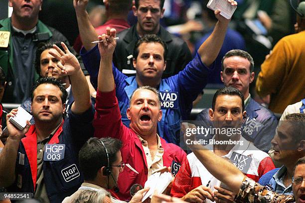 Traders work in the S&P 500 pit at the Chicago Board of Trade in Chicago, Illinois, U.S. On Tuesday, Sept. 2, 2008. U.S. Stocks rallied after...