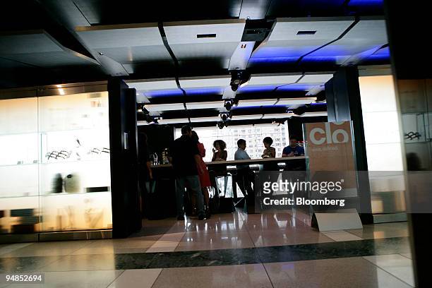 Patrons drink at Clo wine bar located in the Time Warner Center in New York, U.S., on Friday, Aug. 29, 2008. A few sips of Vega Sicilia Cosecha will...