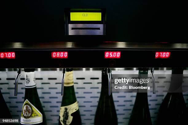 Bottles of wine sit at a wine machine at Clo located in the Time Warner Center in New York, U.S., on Friday, Aug. 29, 2008. A few sips of Vega...