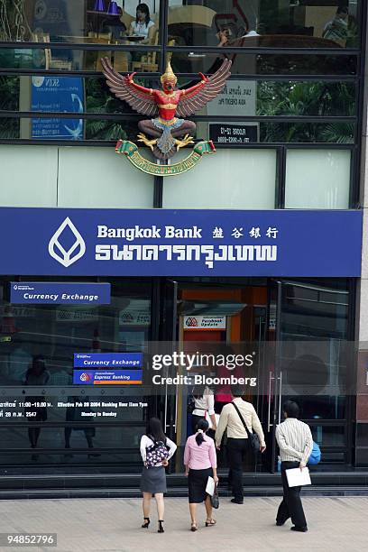 Customers enter a Bangkok Bank Pcl. Branch Friday, January 14, 2005 in Bangkok, Thailand. Thailand's largest lender may post its biggest quarterly...