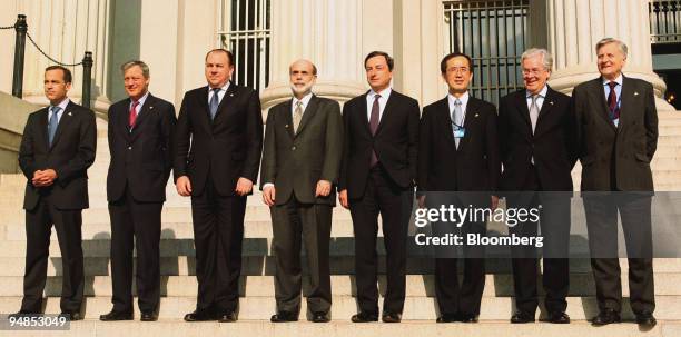 The Group of Seven central bankers pose for a group photo in front of the U.S. Treasury in Washington, D.C., U.S., on Friday, April 11, 2008....