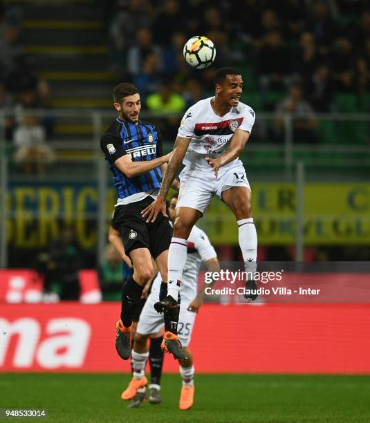 Roberto Gagliardini of FC Internazionale and Senna Miangue of Cagliari Calcio compete for the ball in action during the serie A match between FC...