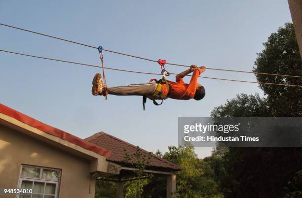 Children enjoying repelling and fun activities at the adventure summer camp in Karjat, on April 18, 2018 in Mumbai, India.