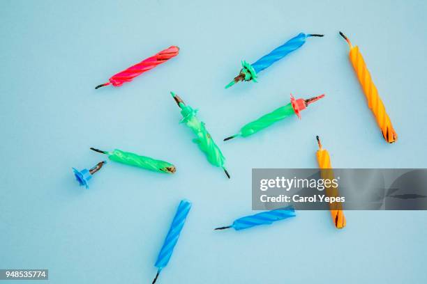 birthday candles, burnt in blue background - verjaardagskaars stockfoto's en -beelden