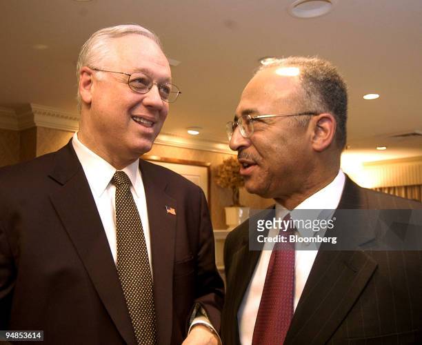 New York State Comptroller Alan Hevesi, left, and New York City Comptroller William C. Thompson chat after a press conference where dissident...
