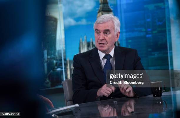 John McDonnell, finance spokesman of the U.K. Opposition Labour party, gestures while speaking during a Bloomberg Television interview in London,...