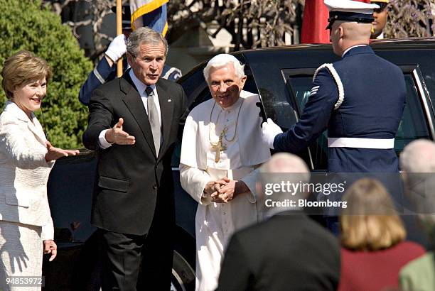 President George W. Bush, center, and First Lady Laura Bush, left, greet Pope Benedict XVI on the South Lawn of the White House in Washington, D.C.,...