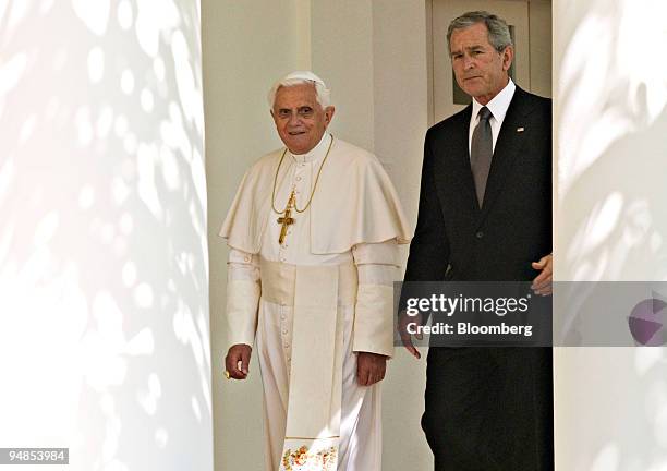 President George W. Bush, right, walks with Pope Benedict XVI outside the White House in Washington, D.C., U.S., on Wednesday, April 16, 2008. Bush...