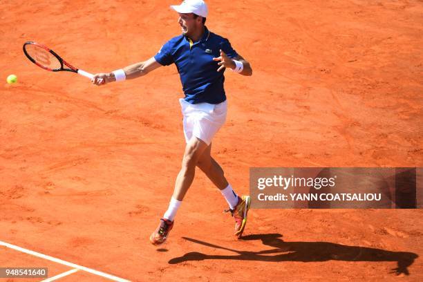 Spain's Roberto Bautista Agut returns the ball to Belgium's David Goffin during their tennis match as part of the Monte-Carlo ATP Masters Series...