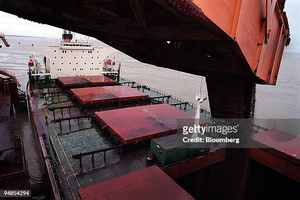Part of a cargo of 168 tons of iron ore is loaded onto a ship at Cia. Vale do Rio Doce's port facility at Sao Luis, Brazil, on Wednesday, April 7,...
