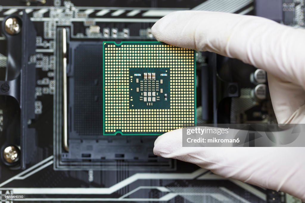 Hand Threaded Cpu Human Hand To Installing Integrated Circuit Cpu High-Res Stock Photo ...