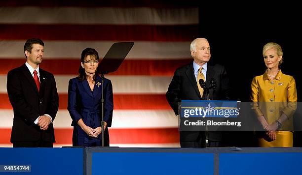 Senator John McCain of Arizona, Republican presidential nominee, at podium, along with his wife Cindy, right, Governor Sarah Palin of Alaska, his...