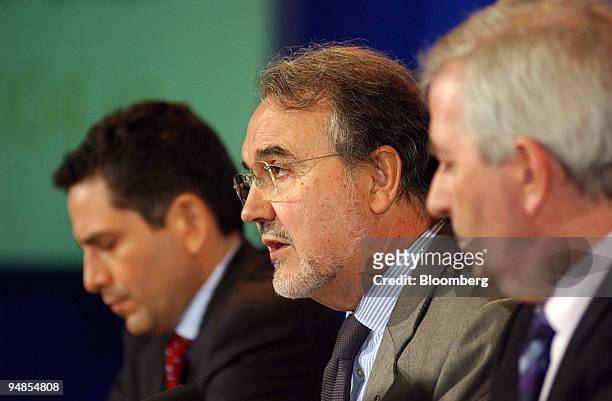 European Union Monetary Affairs Commissioner Pedro Solbes, center, speaks to reporters at a news conference in Punchestown, Ireland, on Friday, April...
