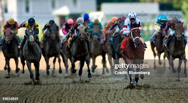 Jockey Kent Desormeaux, riding Big Brown, foreground, leads the pack during the Preakness Stakes at Pimlico Race Course in Baltimore, Maryland, U.S.,...