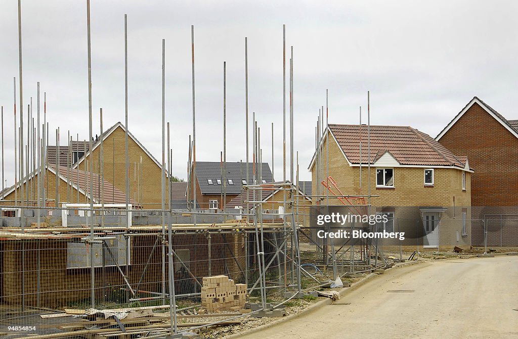 Houses under construction sit next to completed properties o
