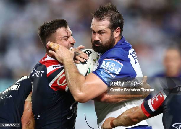 Aaron Woods of the Bulldogs is tackled by James Tedesco of the Roosters during the round seven NRL match between the Canterbury Bulldogs and the...